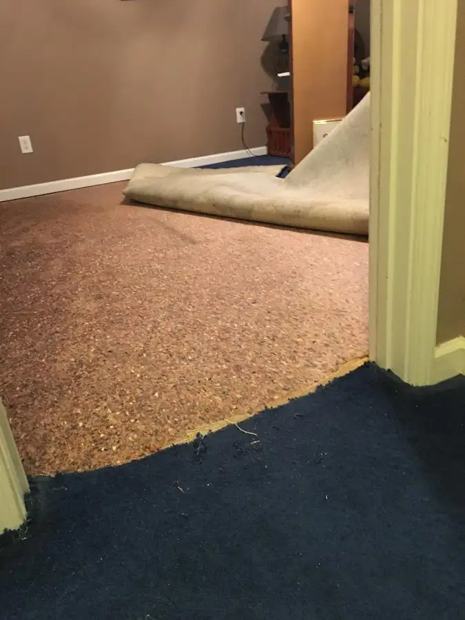 Carpet pad removal revealing water damage during Drying & Dehumidification in Wailea